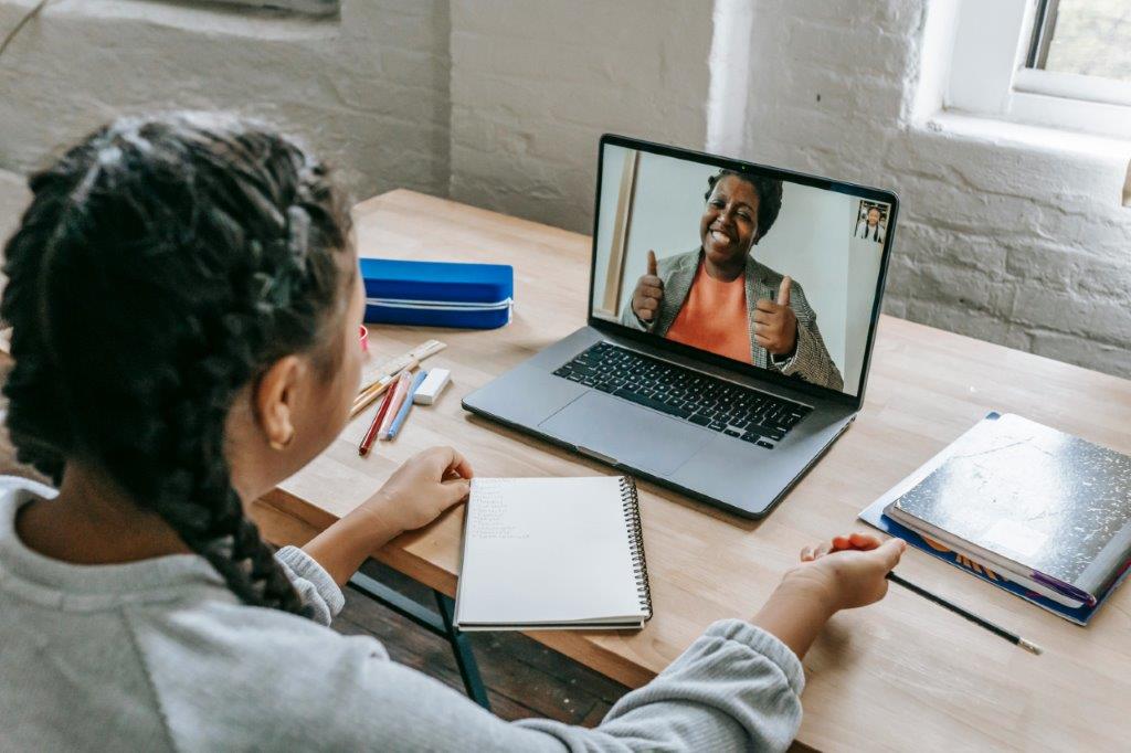 A young person in an online therapy session with a psychologist