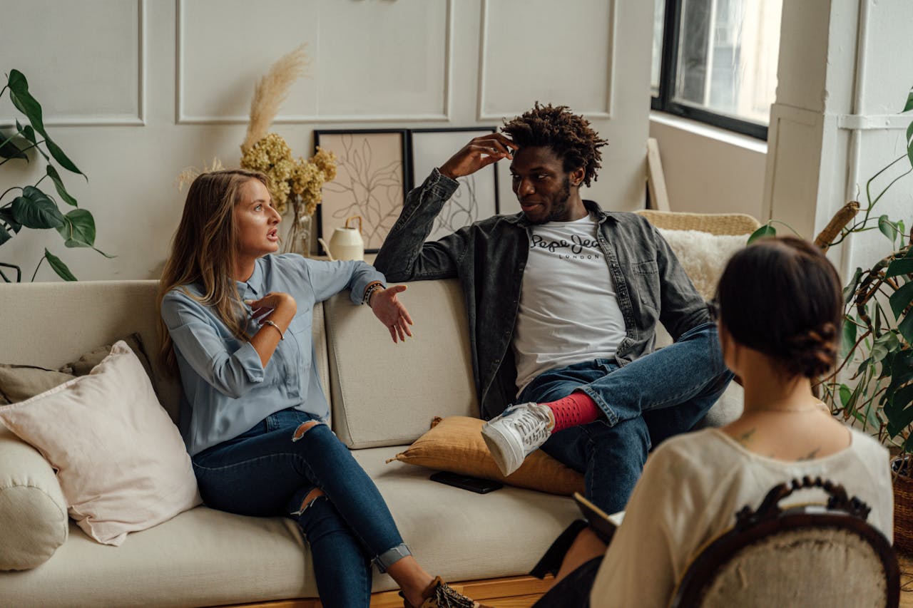 A couple speaking with a psychologist